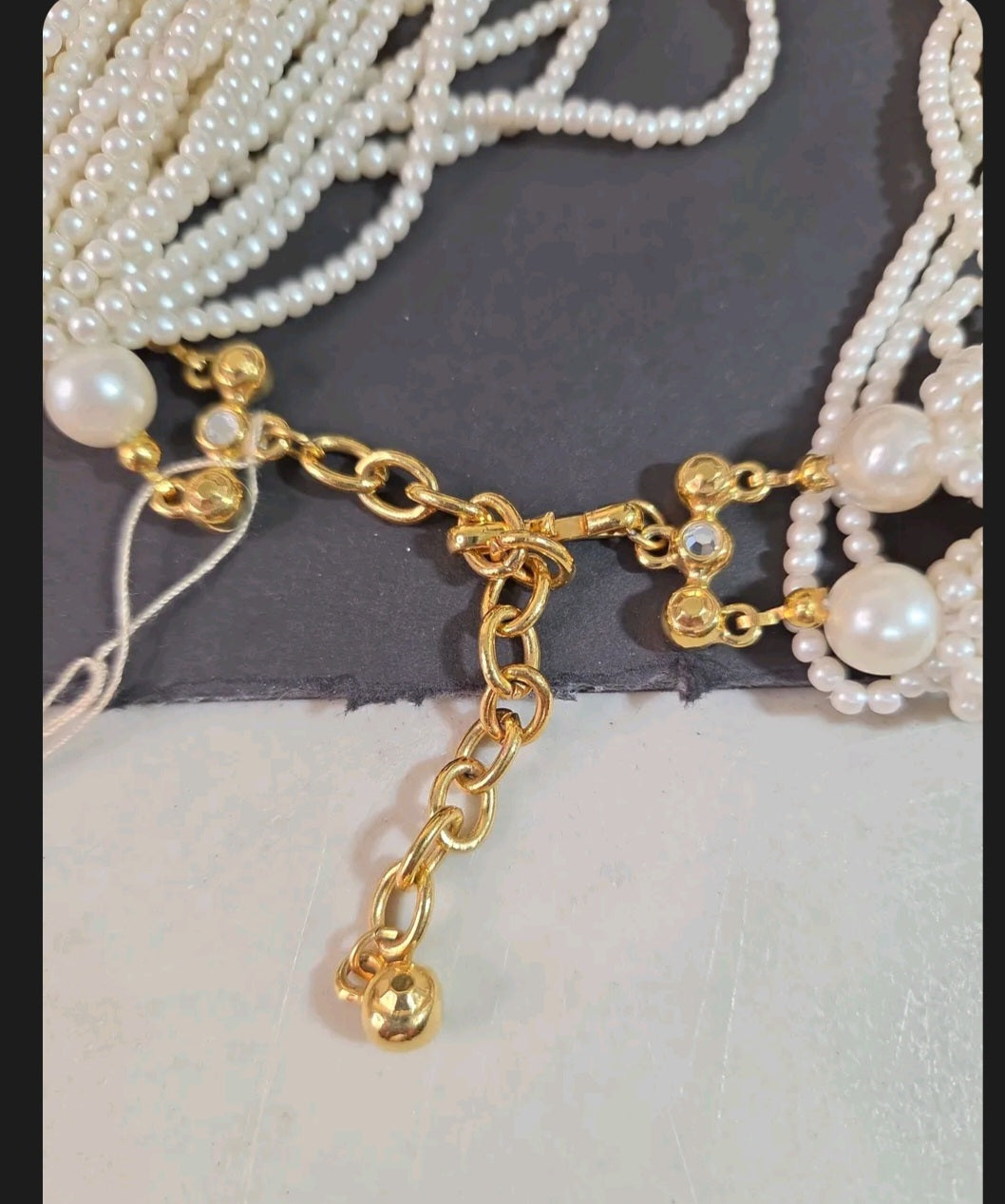 Oddly Darling Vintage multi-strand faux pearl necklace with gold-tone adjustable chain and rhinestone clasp detail
