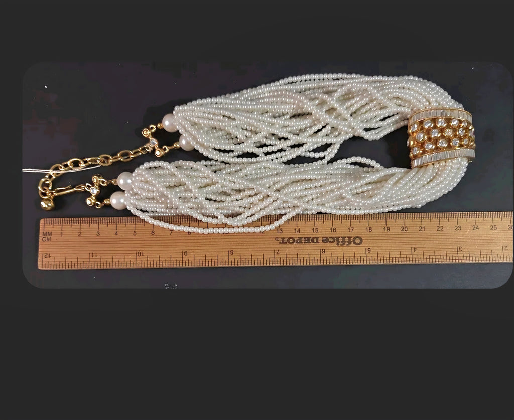 Oddly Darling Vintage multi-strand cream faux pearl necklace with a gold-tone rhinestone centerpiece and ruler scale.