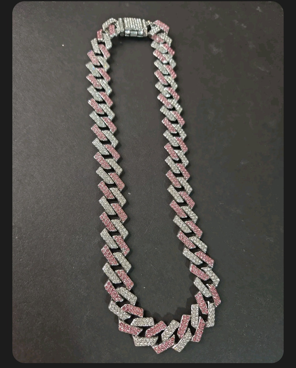 Oddly Darling Vintage iced-out cuban link necklace with alternating clear and pink crystal stones on a heavy chain.