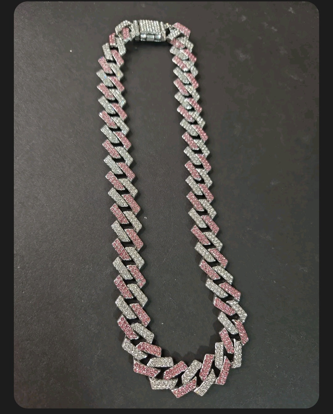 Oddly Darling Vintage iced-out cuban link necklace with alternating clear and pink crystal stones on a heavy chain.