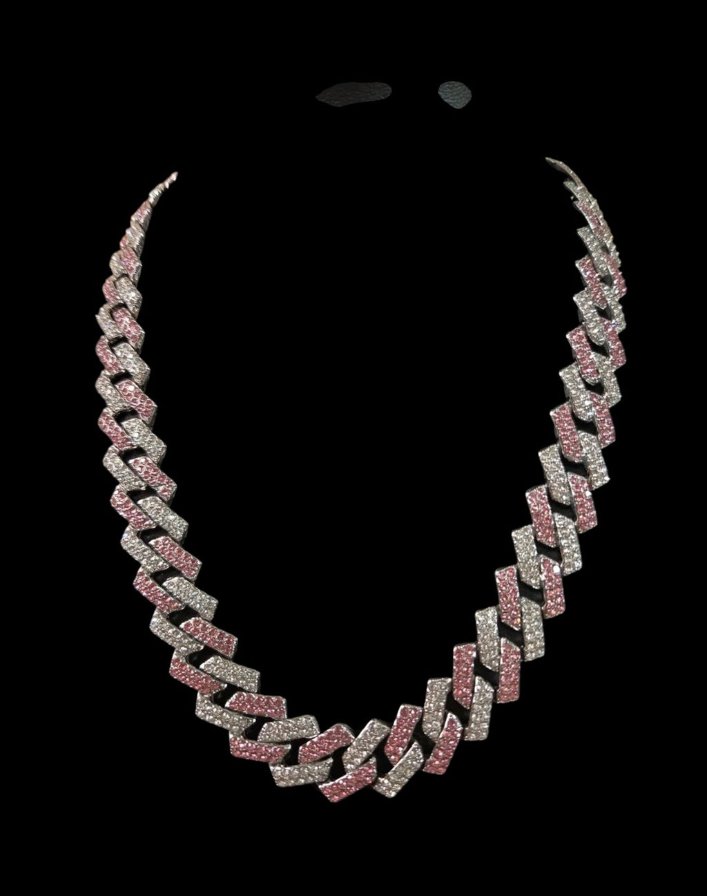 Oddly Darling Vintage iced-out cuban link necklace with alternating clear and pink crystal stones on a black background.