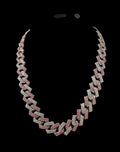 Oddly Darling Vintage iced-out cuban link necklace with alternating clear and pink crystal stones on a black background.
