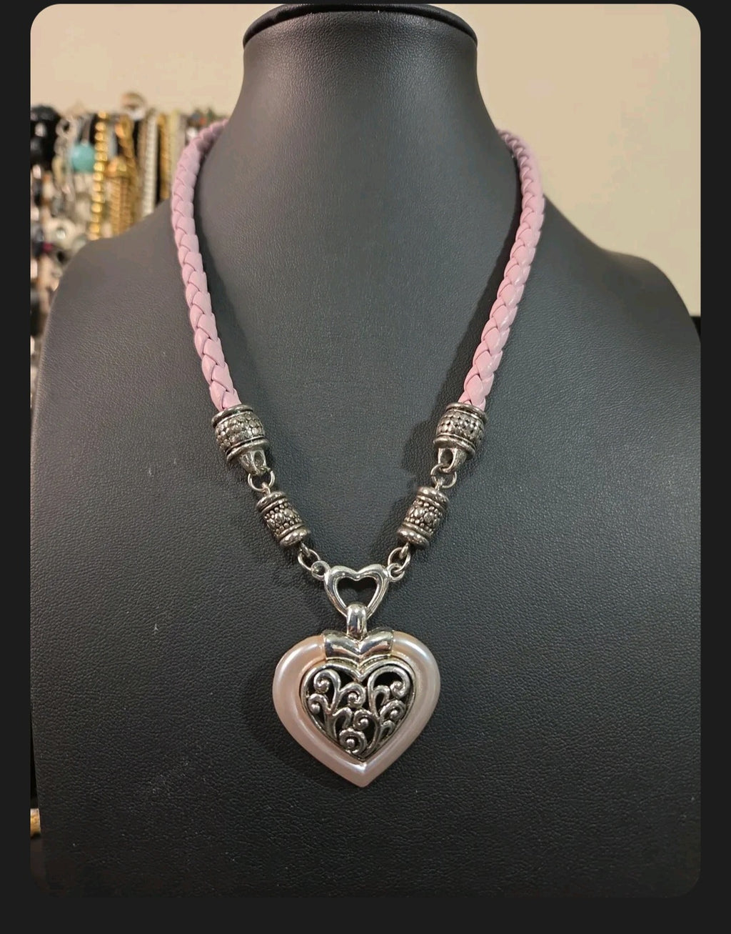 Oddly Darling Vintage heart pendant necklace with silver filigree, pearlescent pink border, and braided light pink cord