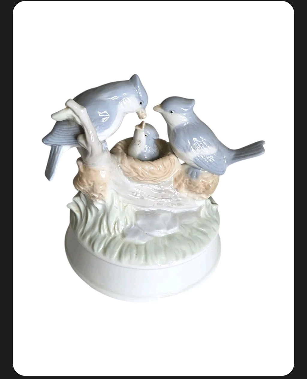 Oddly Darling Vintage porcelain music box featuring a blue bird family in a nest with soft pastel tones.