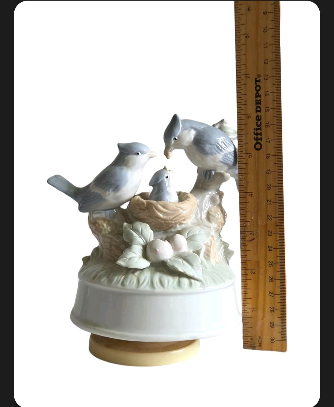 Oddly Darling Vintage porcelain music box featuring a bird family in a nest with soft pastel blue and cream tones.