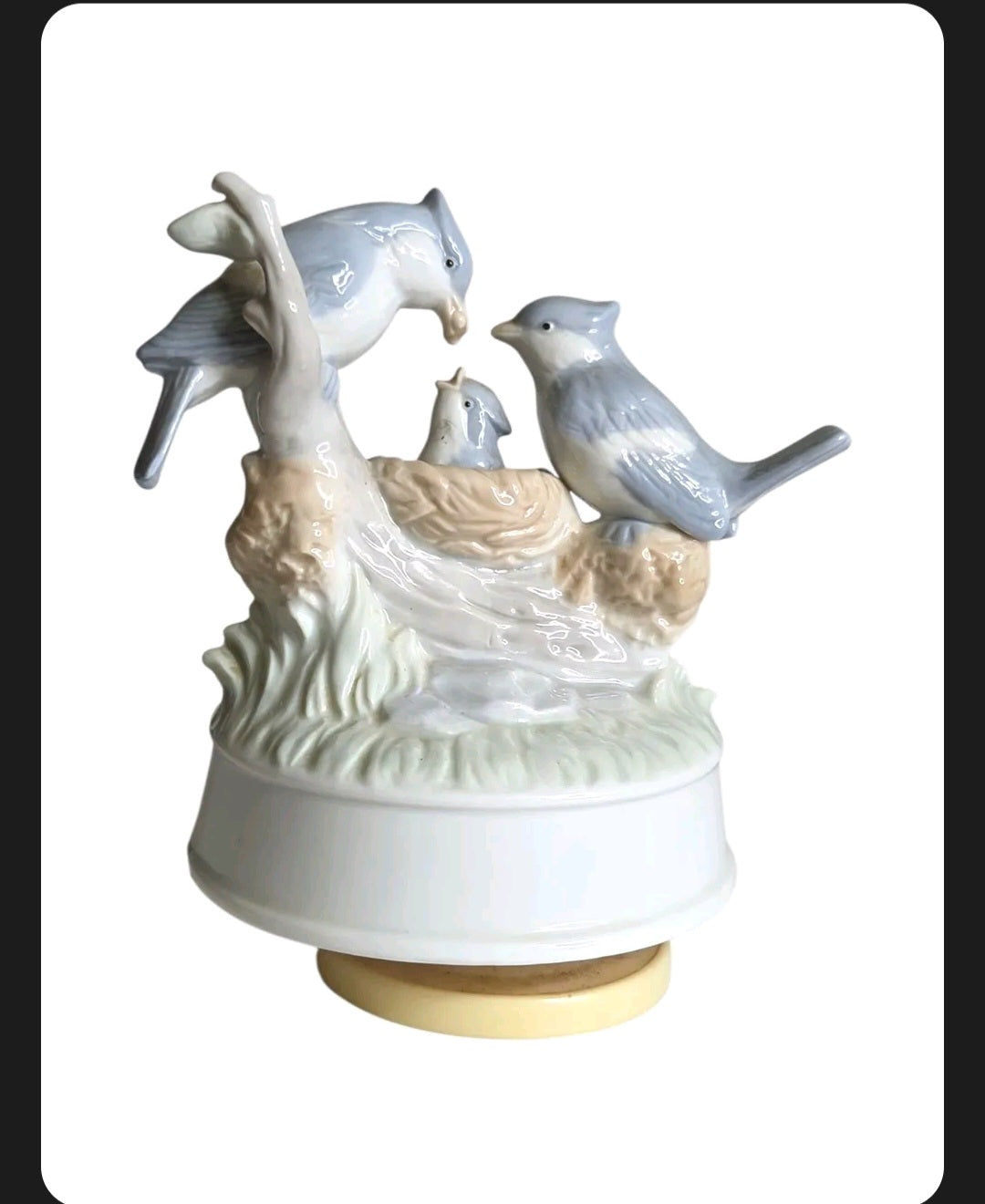 Oddly Darling Vintage porcelain music box featuring a blue bird family in a nest with delicate pastel detailing.
