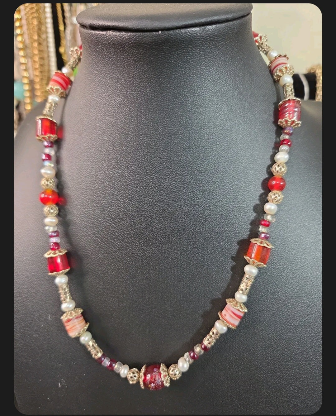 Oddly Darling Vintage statement necklace featuring crimson red glass beads, white pearls, and gold-tone filigree spacers.
