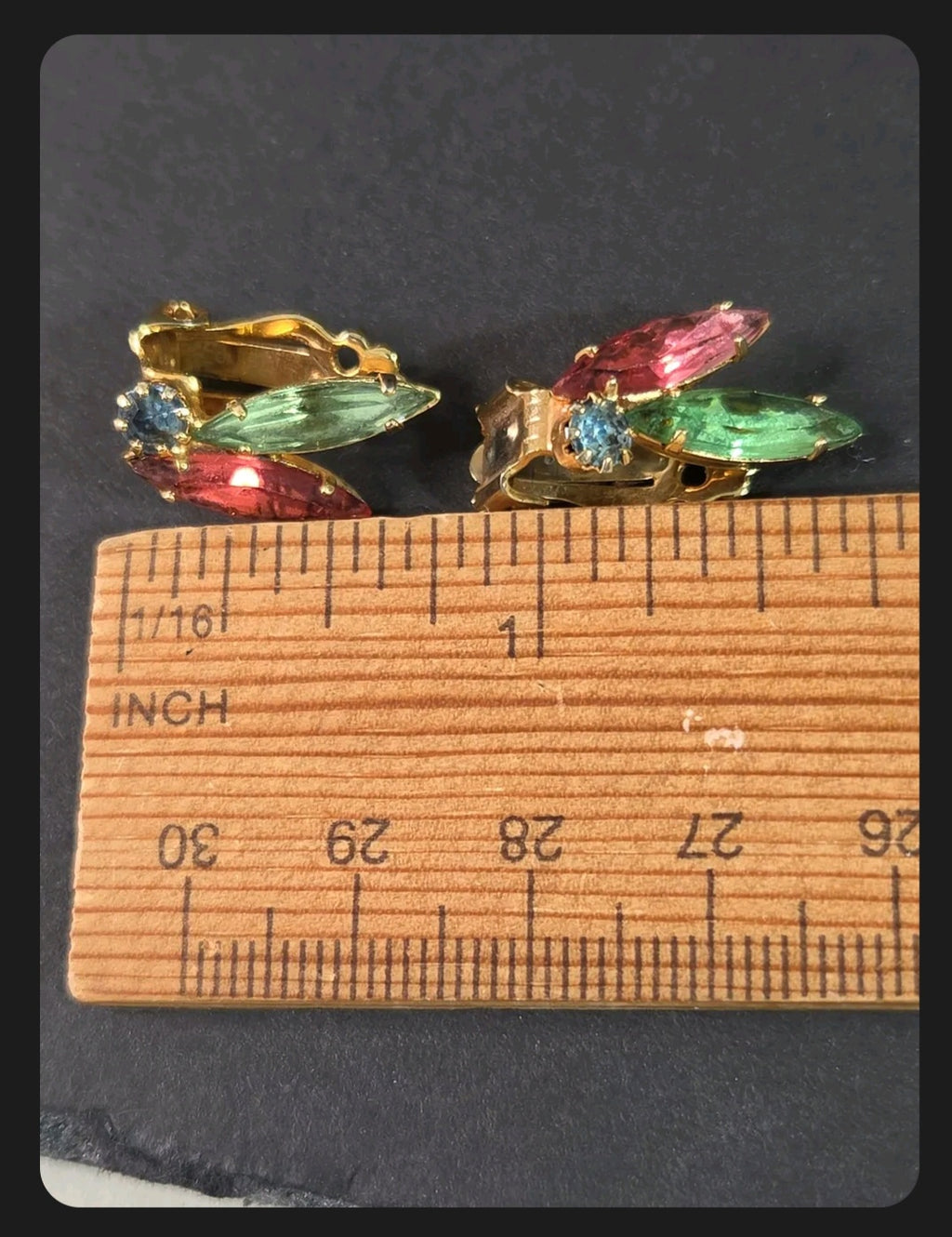 Oddly Darling Vintage multi-colored rhinestone clip-on earrings with ruby red, emerald green, and blue crystals.