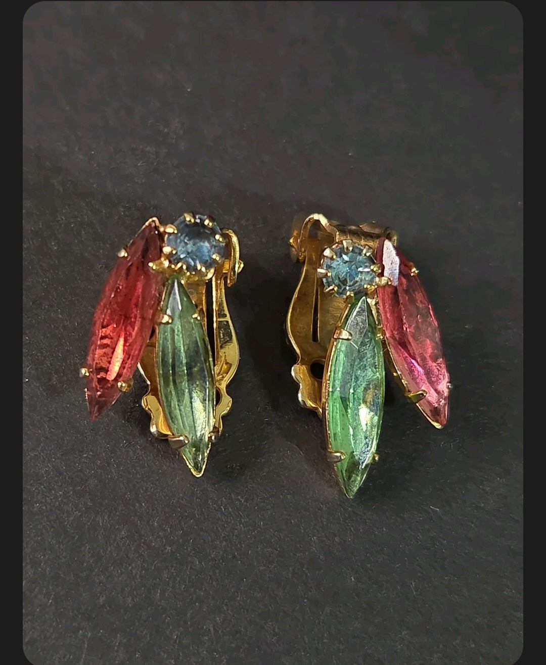 Oddly Darling Vintage gold-tone clip-on earrings featuring marquise-cut ruby red, emerald green, and blue crystals.
