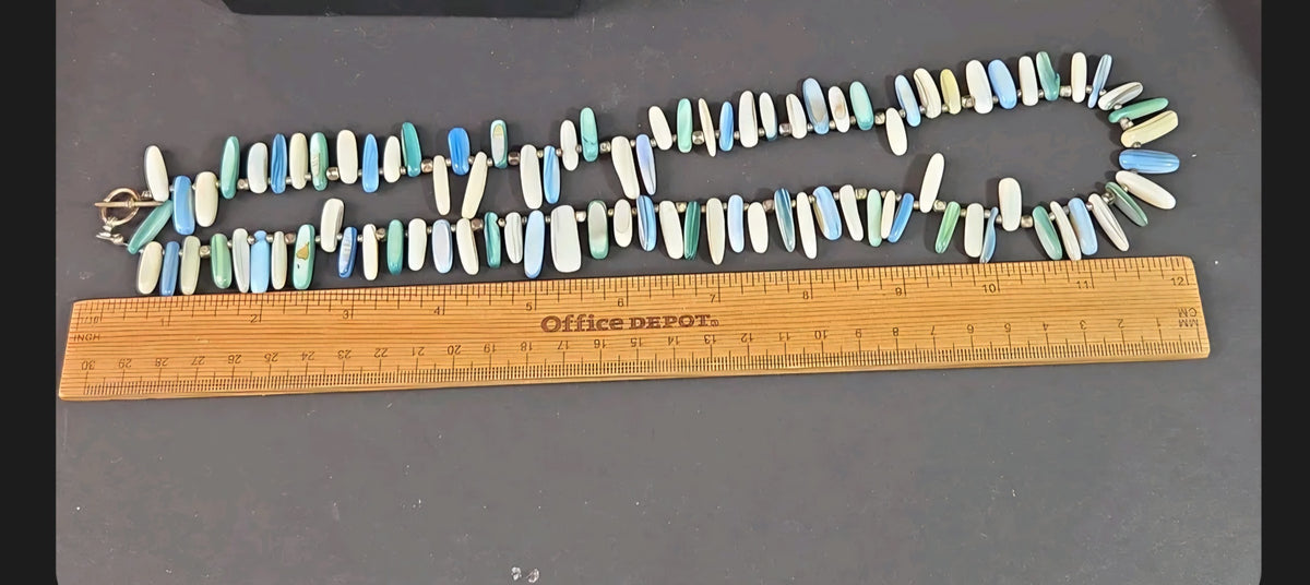 Oddly Darling Vintage multi-colored shell bead necklace with ocean blue, green, and white elongated beads and toggle
