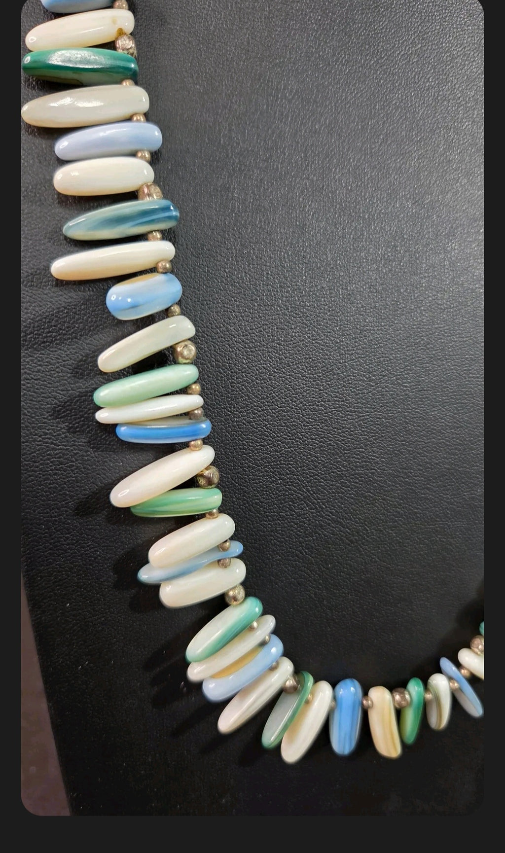 Oddly Darling Vintage multi-colored shell bead necklace with ocean blue, green, and white polished elongated beads.