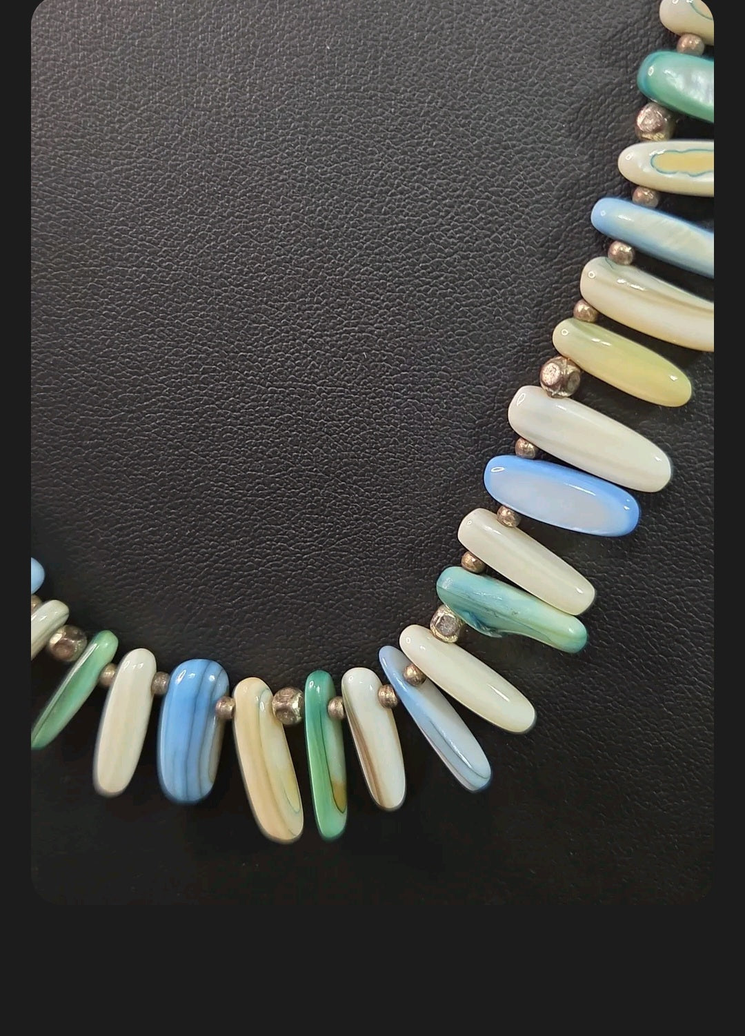 Oddly Darling Vintage statement necklace featuring elongated shell beads in ocean blue, green, and white with spacers.
