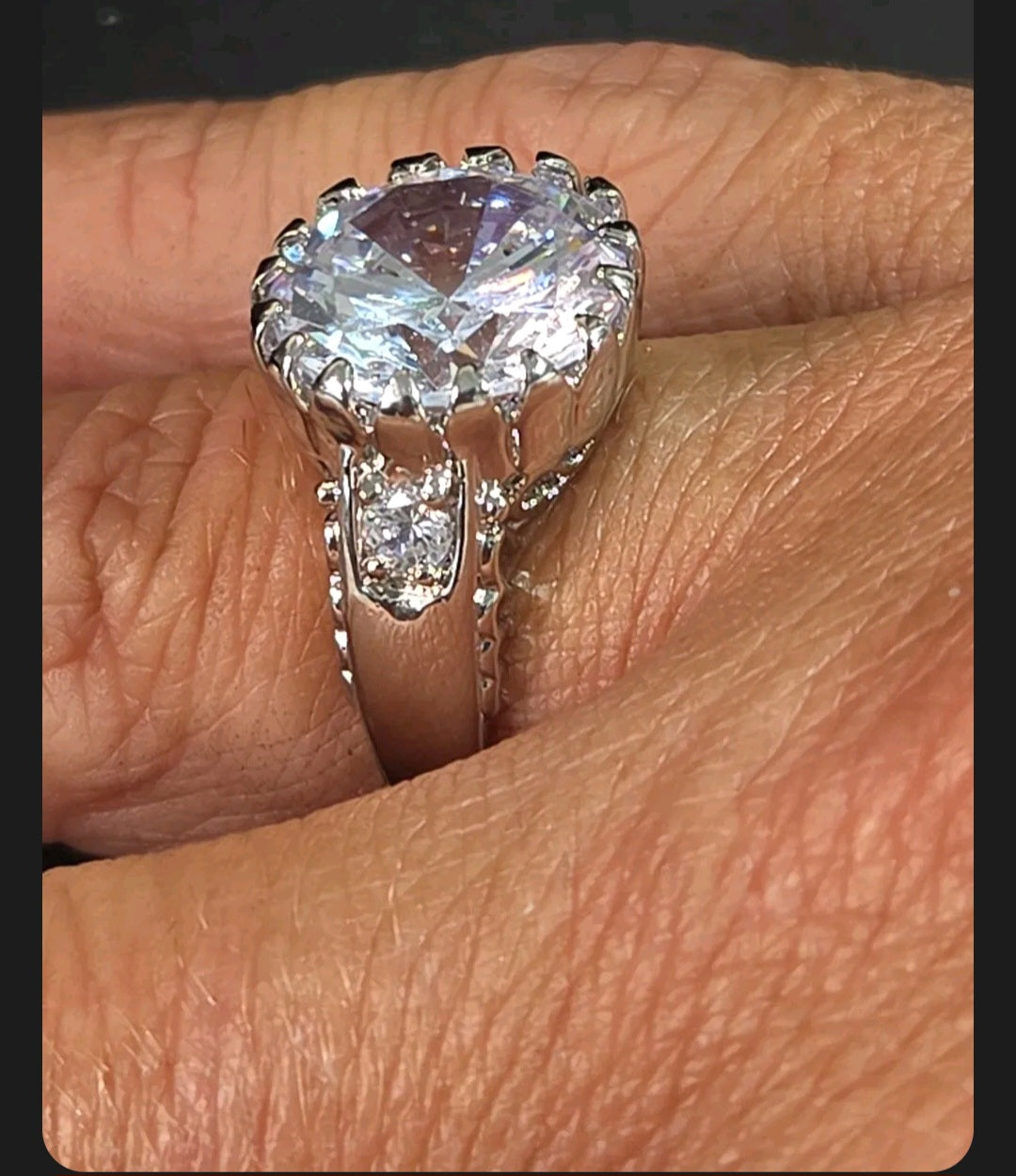 Oddly Darling Vintage silver-tone cocktail ring featuring a large brilliant-cut central stone and filigree detailing.