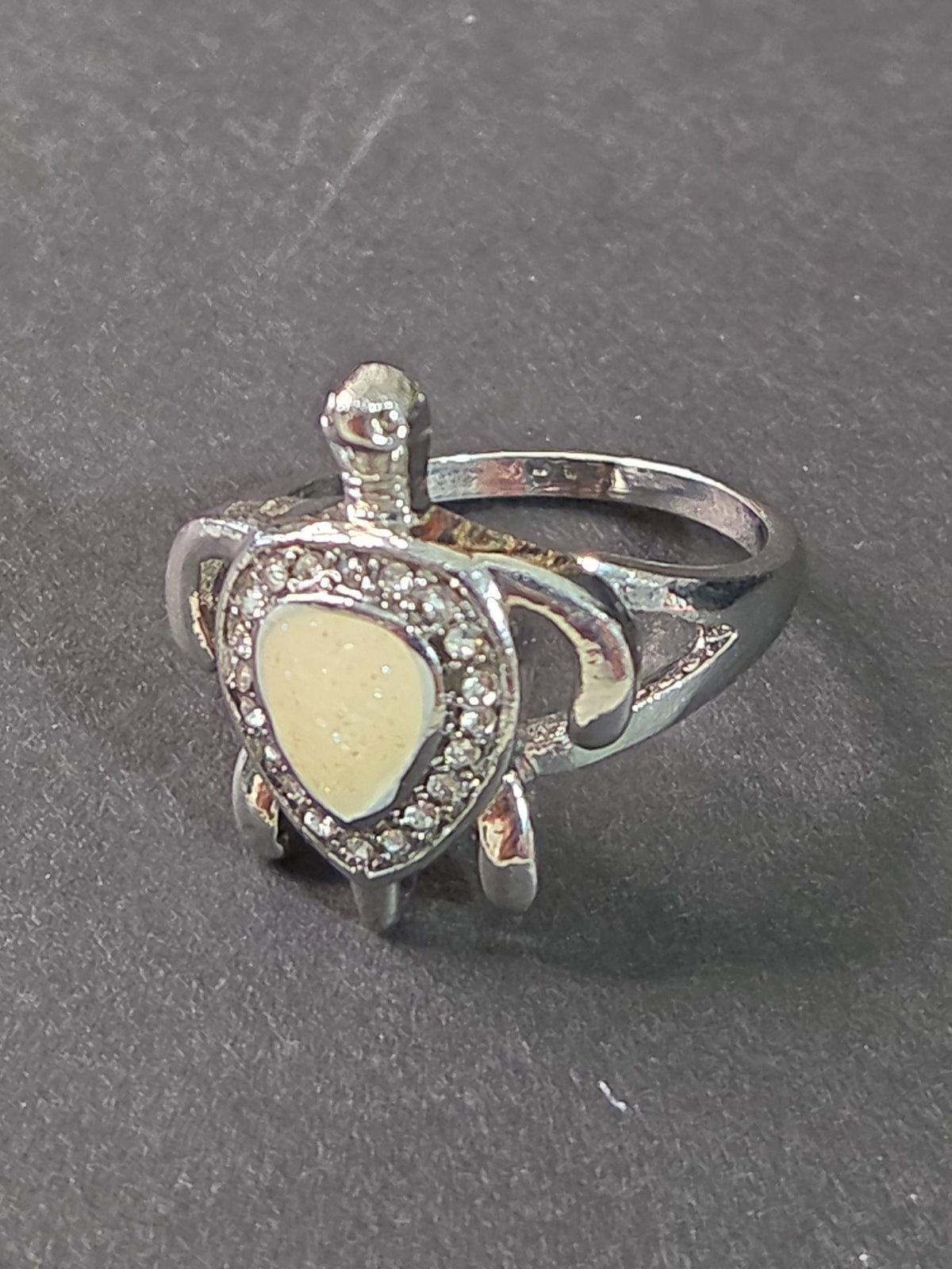 Oddly Darling Vintage silver-tone sea turtle statement ring with a pearlescent shell inlay and clear crystal halo.