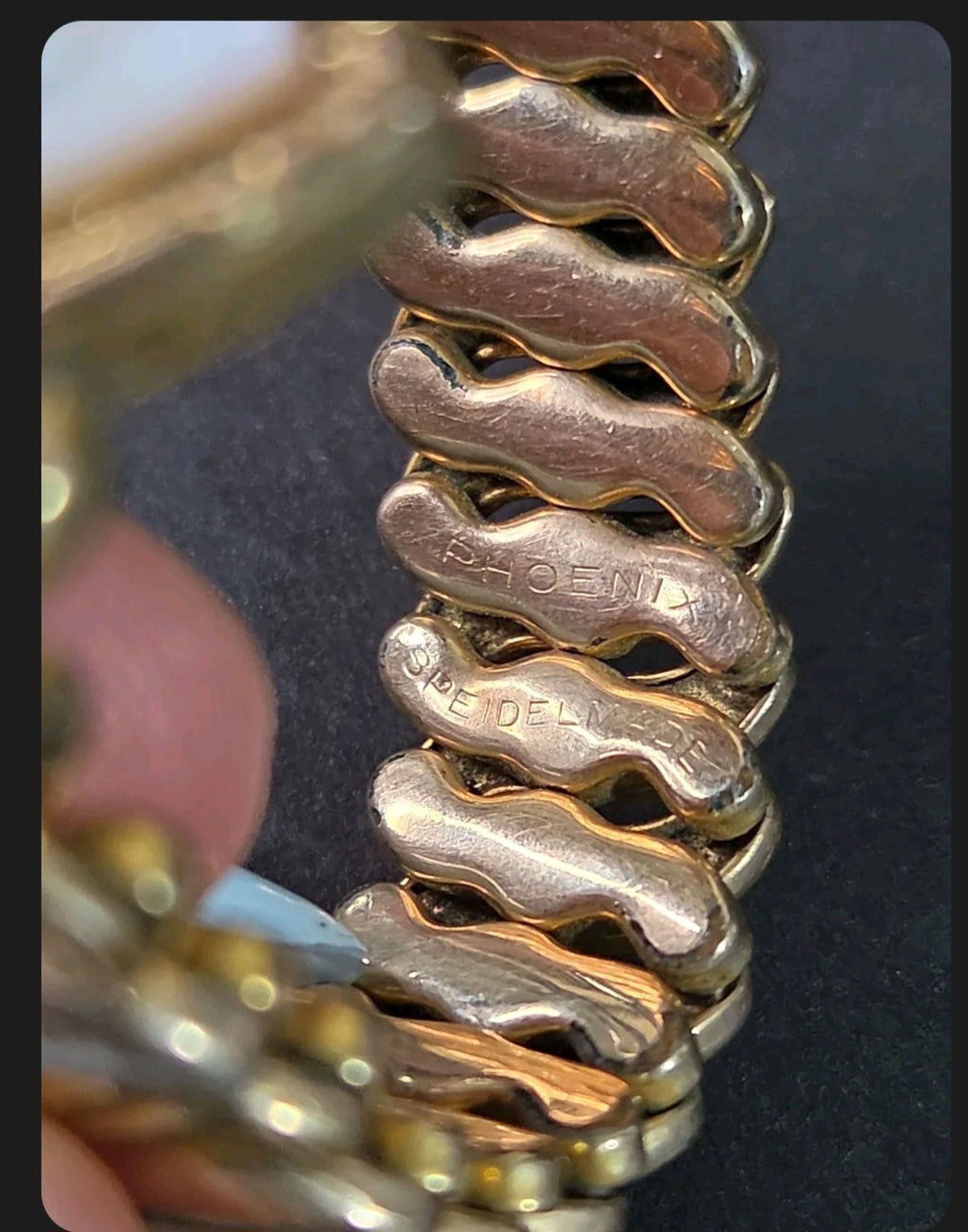 Oddly Darling Vintage Speidel Phoenix gold-tone expansion bracelet showing engraved links and flexible construction