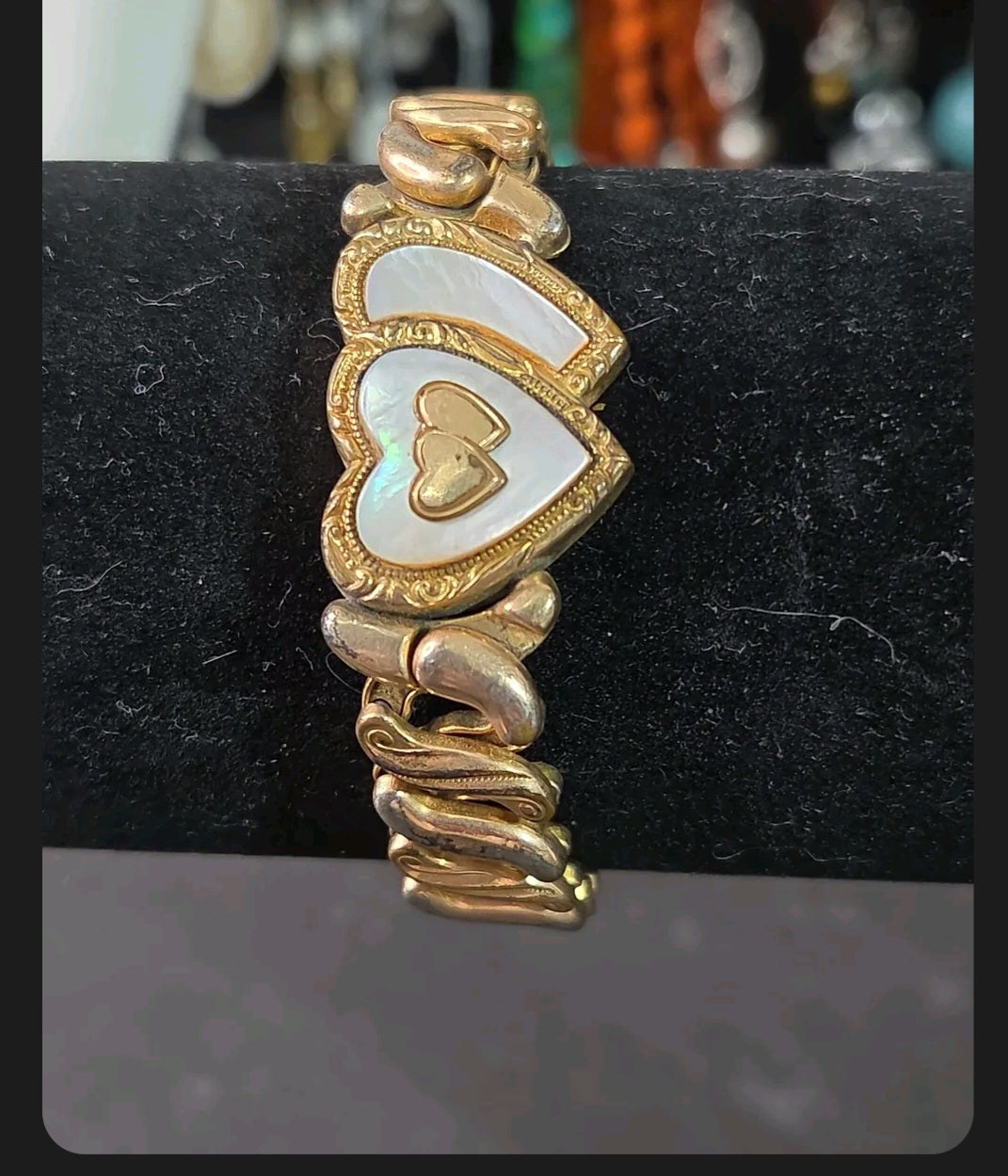 Oddly Darling Vintage Speidel gold-tone expansion bracelet featuring dual heart motifs with mother-of-pearl inlays.