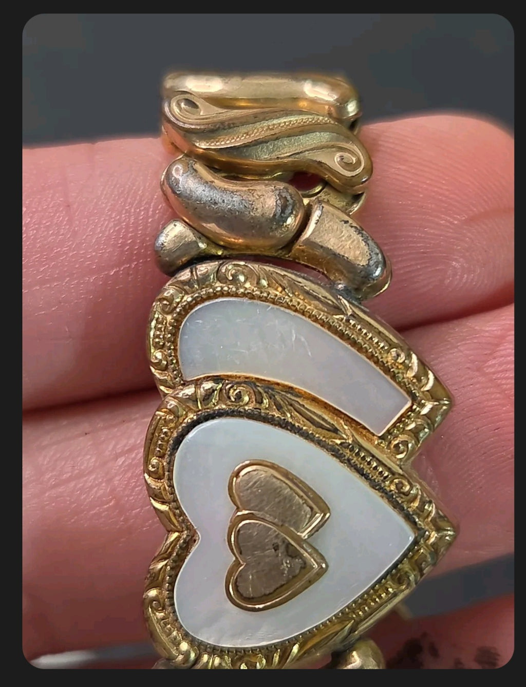 Oddly Darling Vintage Speidel gold-tone expansion bracelet featuring dual heart motifs with mother-of-pearl inlays.