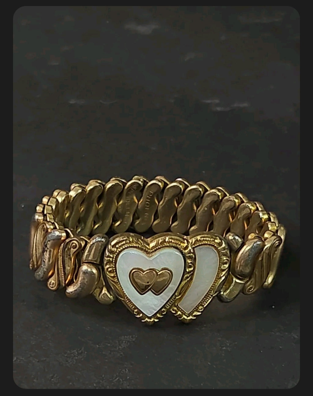 Oddly Darling Vintage Speidel expansion bracelet featuring dual hearts with mother-of-pearl inlay and gold-tone finish