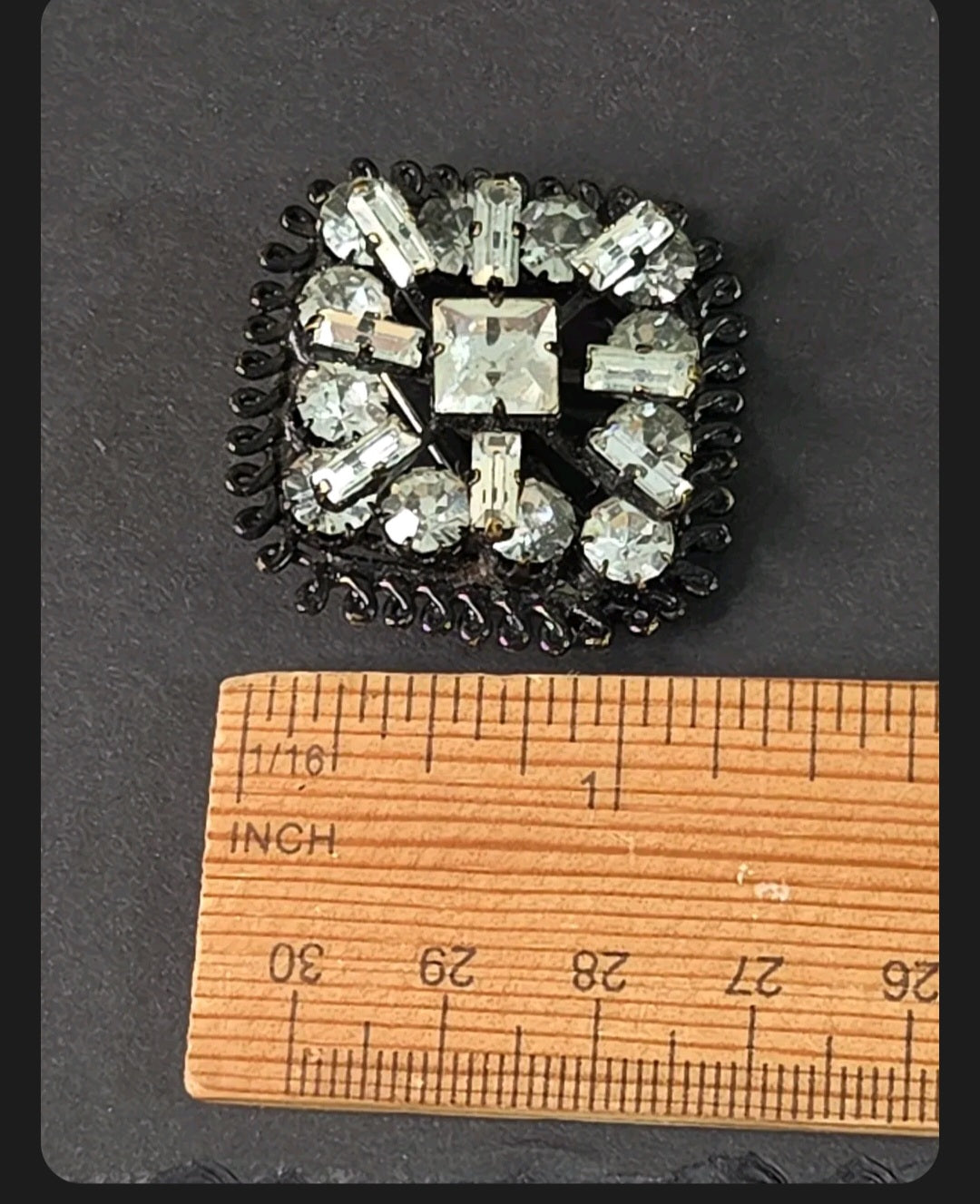 Oddly Darling Vintage square brooch with clear crystals and gunmetal setting, featuring baguette and round stones.