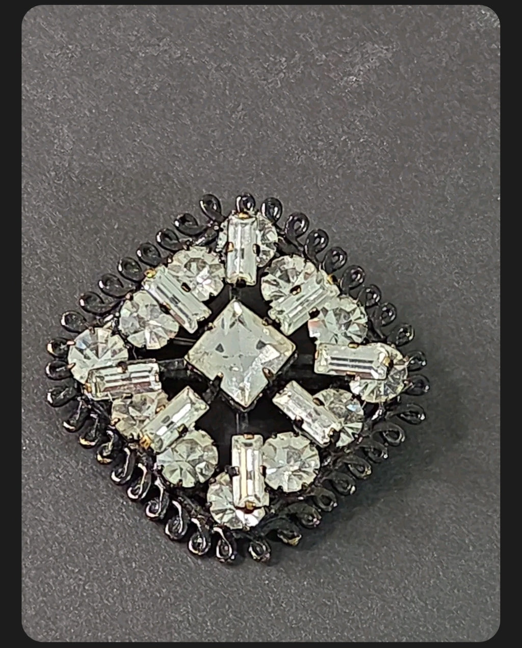 Oddly Darling Vintage square brooch with clear baguette and round crystals in a dark gunmetal setting.