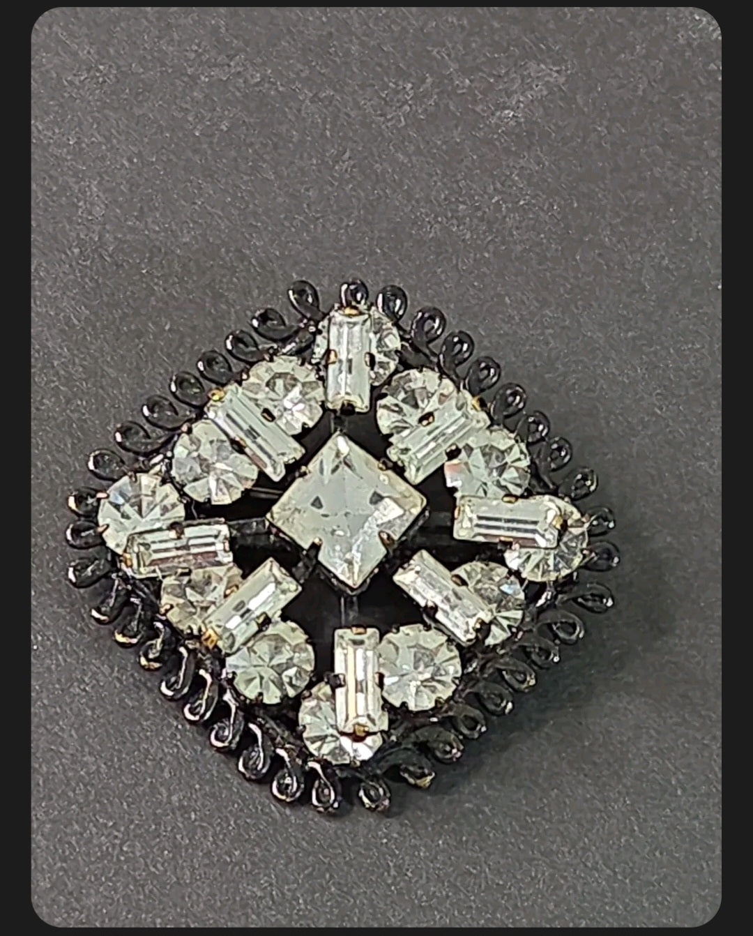 Oddly Darling Vintage square brooch with clear baguette and round crystals in a dark gunmetal setting.