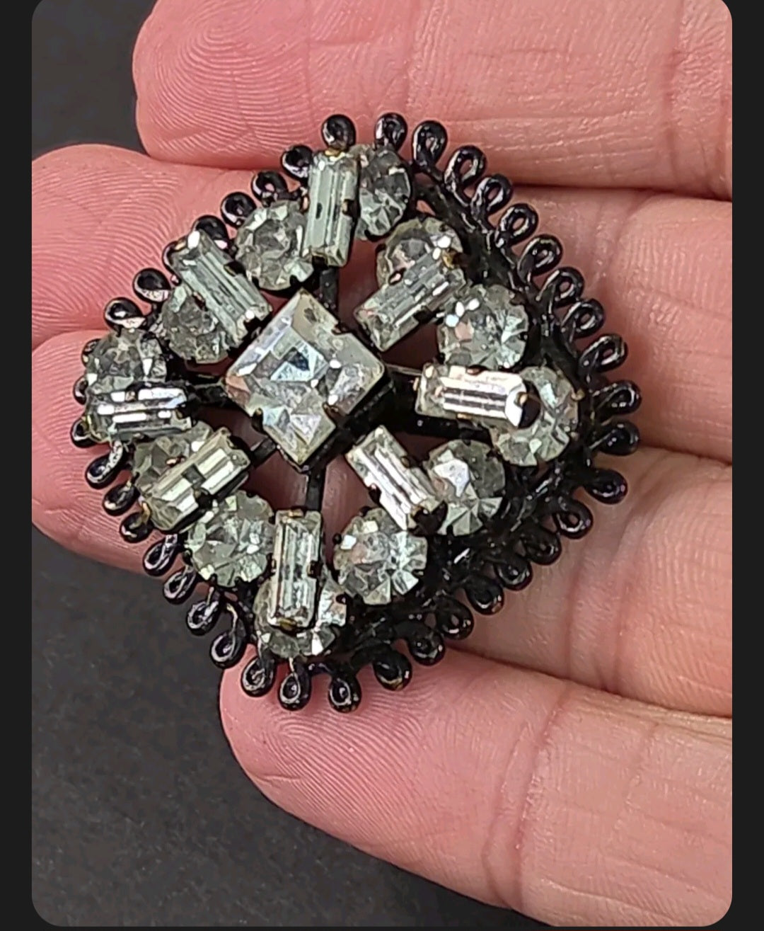 Oddly Darling Vintage square brooch with clear baguette and round crystals in a dark gunmetal setting with wirework.