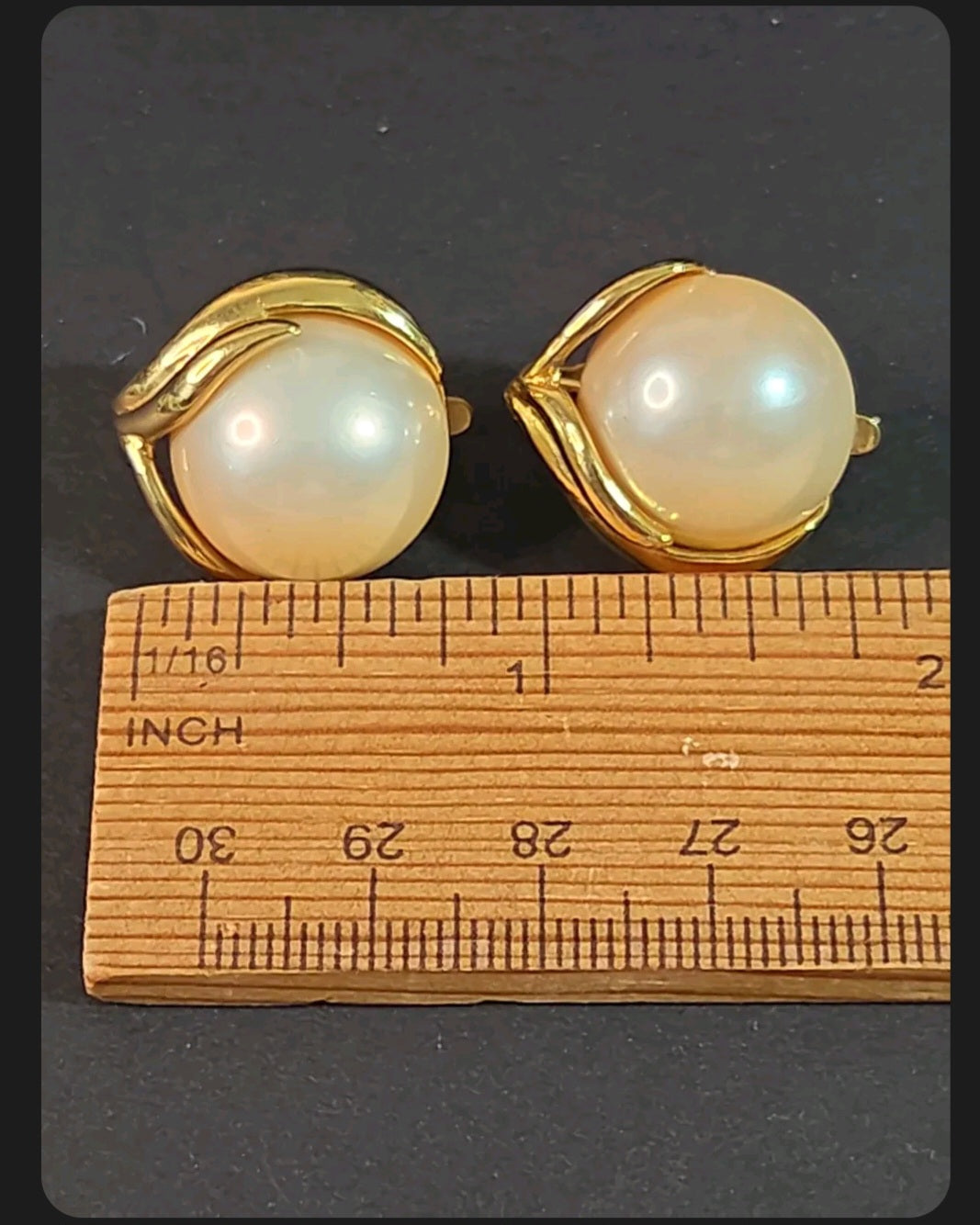 Oddly Darling Vintage Trifari clip-on earrings featuring large faux pearls in a gold-tone leaf metal setting
