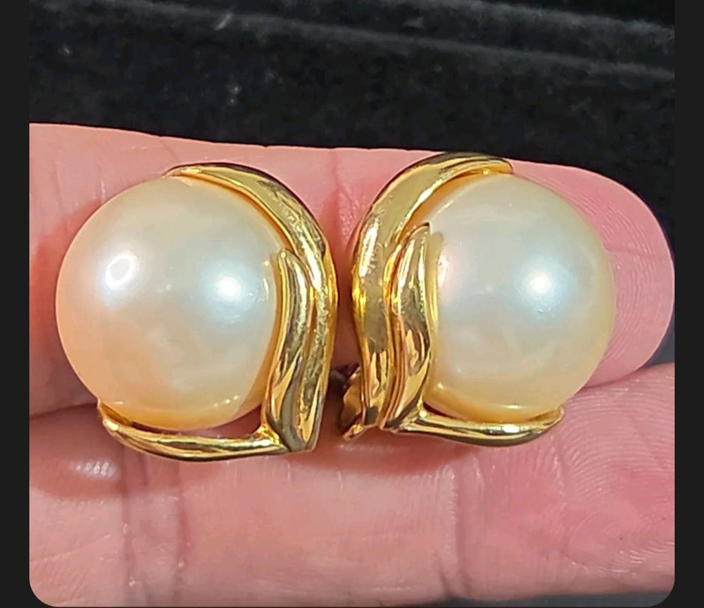 Oddly Darling Vintage Trifari clip-on earrings featuring large faux pearls in a polished gold-tone leaf setting.