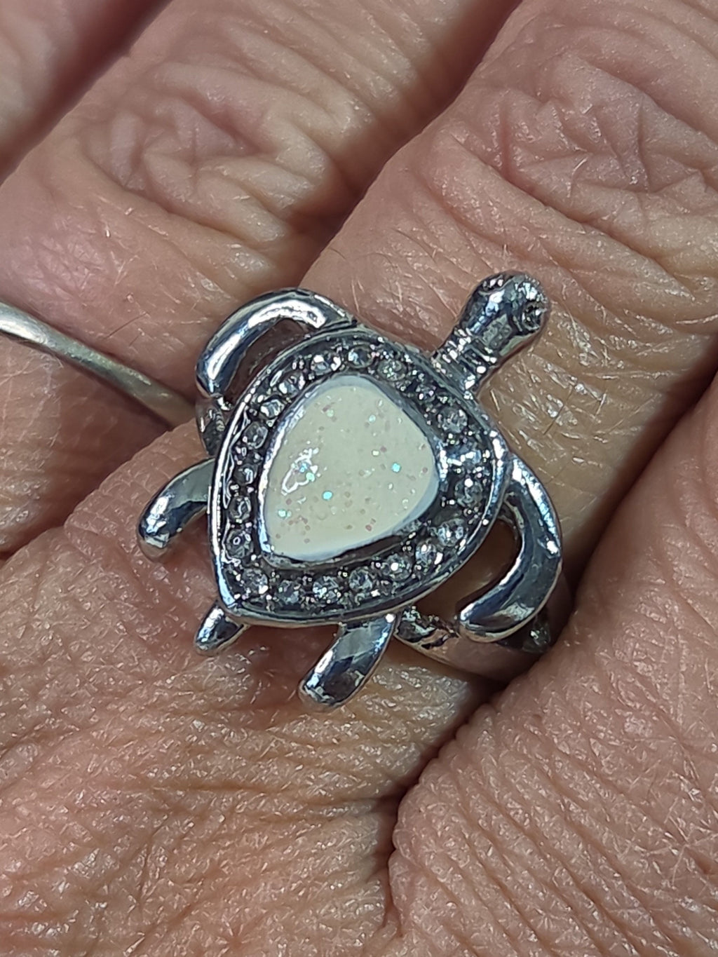 Oddly Darling Vintage silver-tone sea turtle statement ring with a pearlescent shell inlay and clear crystal halo.