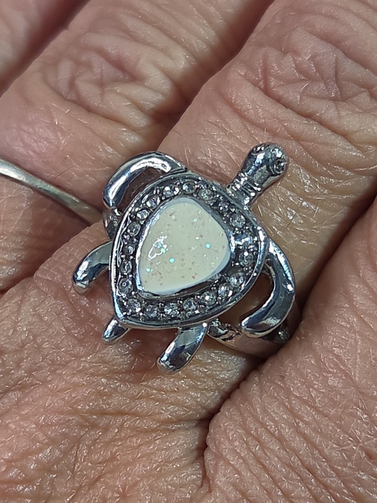 Oddly Darling Vintage silver-tone sea turtle statement ring with a pearlescent shell inlay and clear crystal halo.