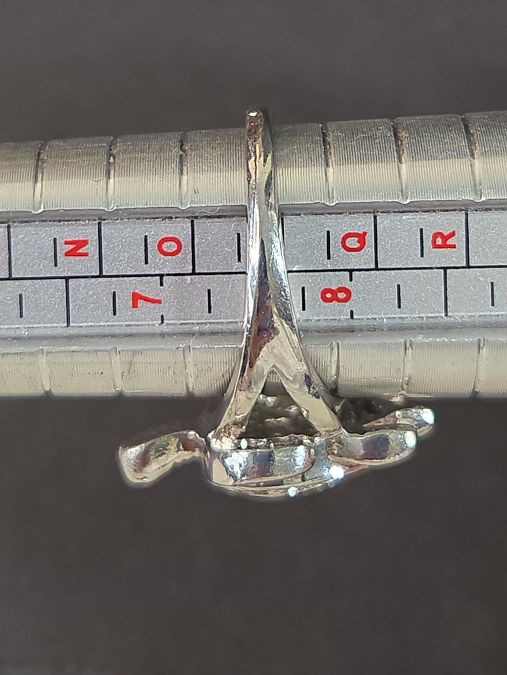 Oddly Darling Vintage silver-tone sea turtle statement ring on a metal ring sizer showing size 8