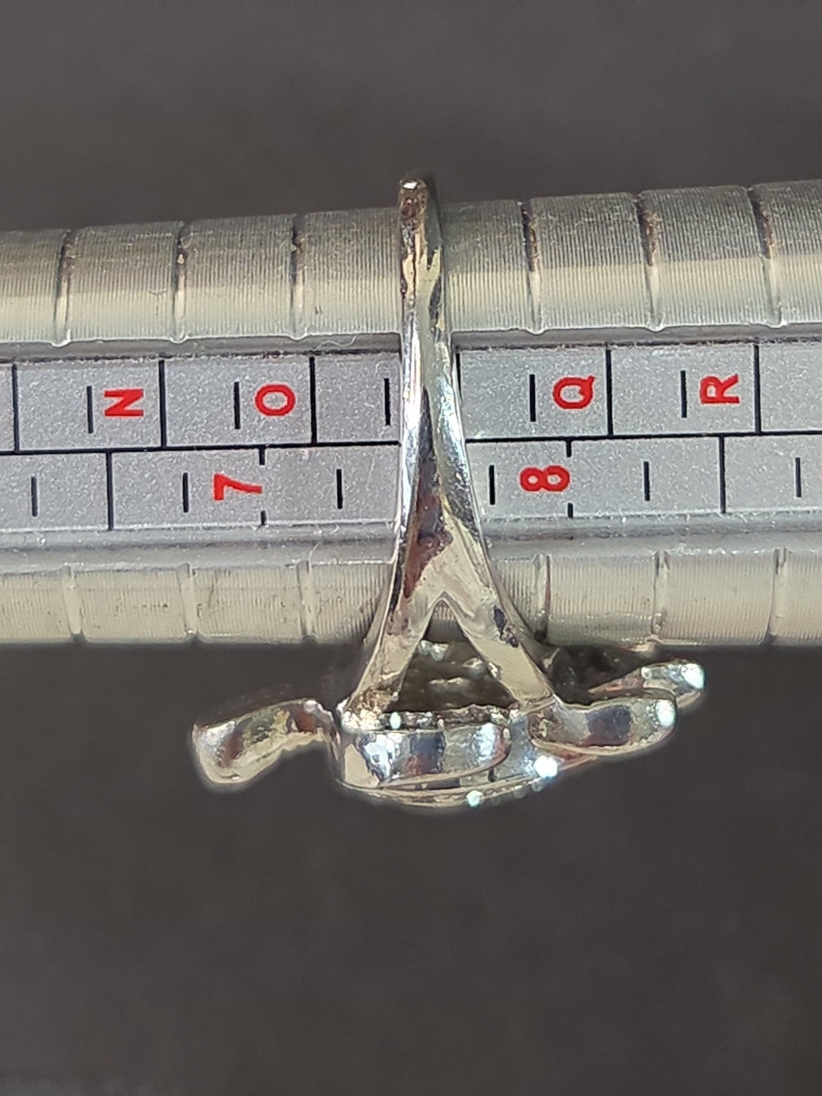 Oddly Darling Vintage silver-tone sea turtle statement ring on a metal ring sizer showing size 8