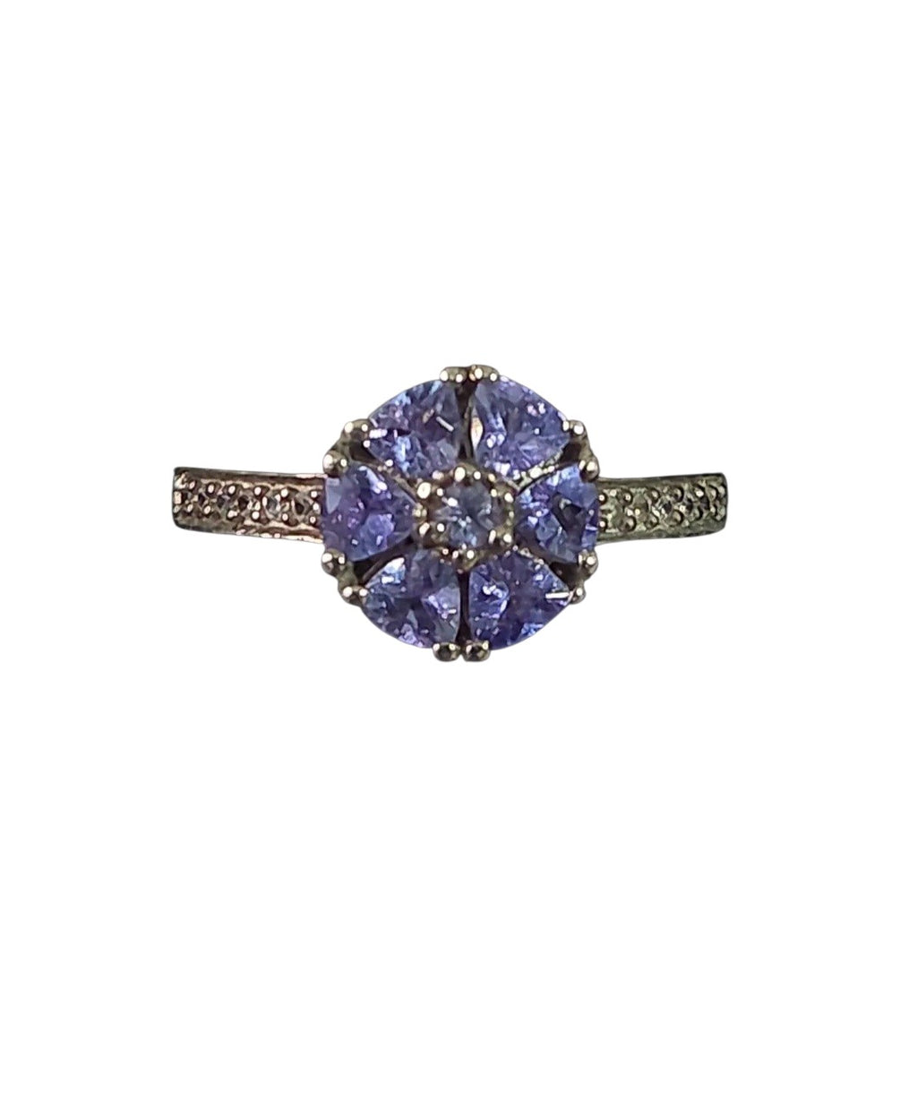 Oddly Darling Vintage floral cluster ring featuring violet gemstones in a flower motif with shimmering accent stones.