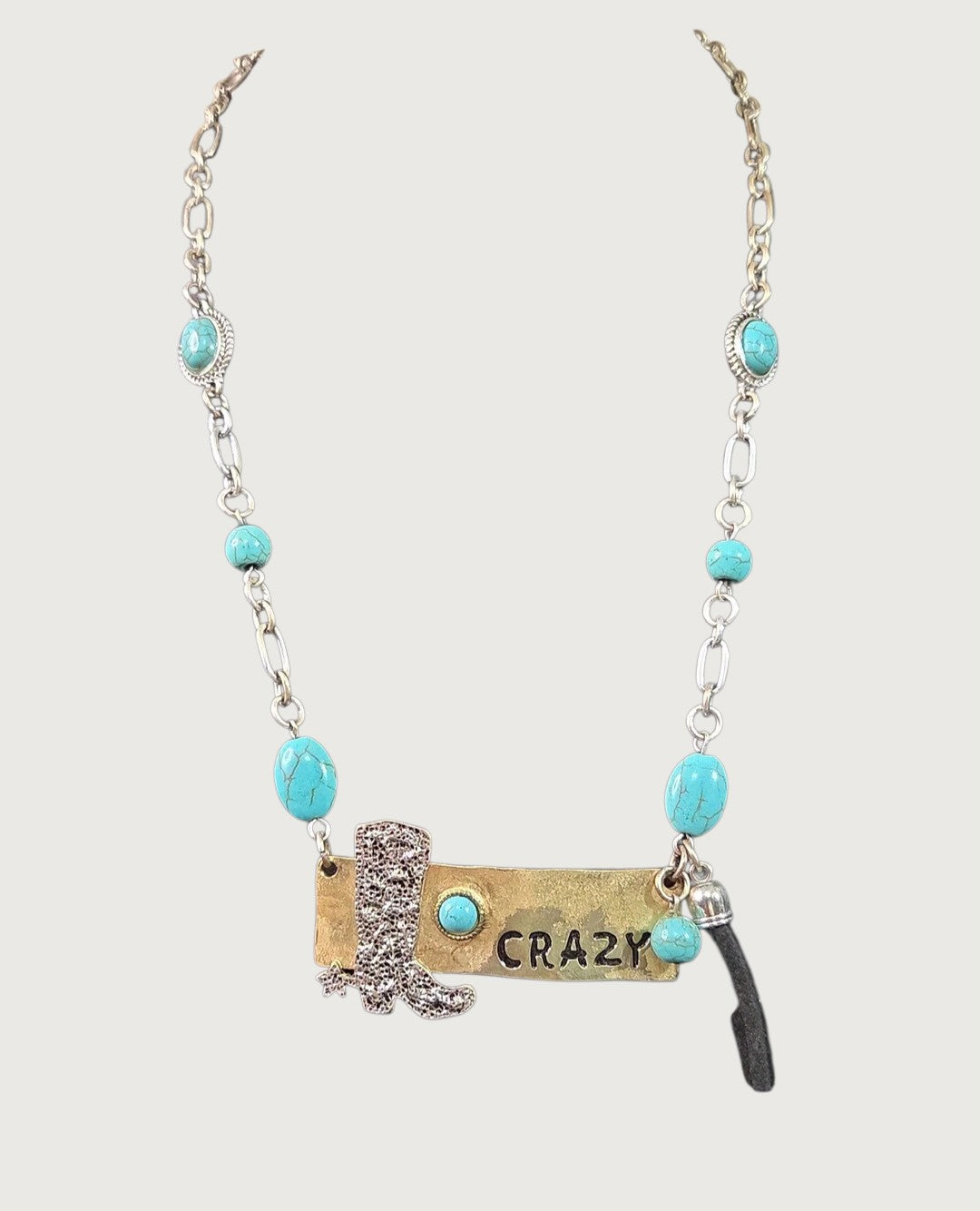 Oddly Darling Vintage western statement necklace with a cowboy boot charm, CRAZY brass plate, and turquoise beads.